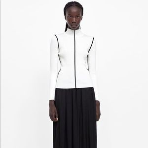 Cream sweater with black piping